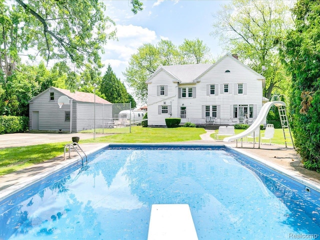2815 Military St, Fort Gratiot, MI 48060 - view of pool with a water slide, a diving board, and a deck