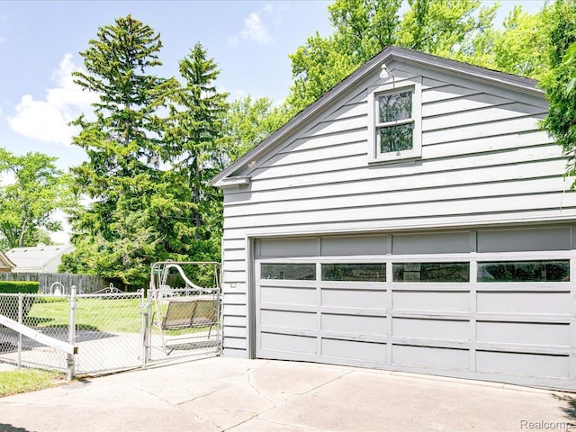 2815 Military St, Fort Gratiot, MI 48060 - garage featuring a gate and concrete driveway