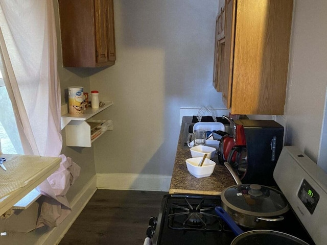 1925 Douglas Ave, Kalamazoo, MI 49007 - kitchen featuring brown cabinetry and wood finished floors