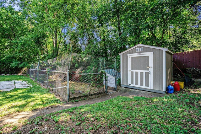 835 Farrell Ave, Kalamazoo, MI 49006 - view of shed featuring a fenced backyard and a vegetable garden
