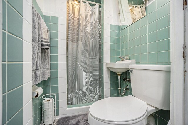 835 Farrell Ave, Kalamazoo, MI 49006 - bathroom with tile walls and a shower with shower curtain