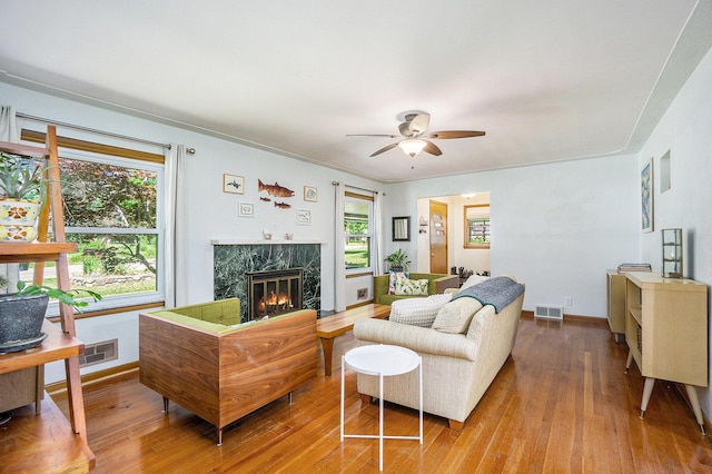 835 Farrell Ave, Kalamazoo, MI 49006 - living area with ceiling fan, wood-type flooring, and a high end fireplace