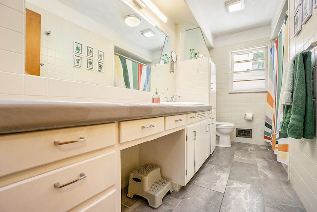835 Farrell Ave, Kalamazoo, MI 49006 - bathroom with tile walls, vanity, and a shower with curtain