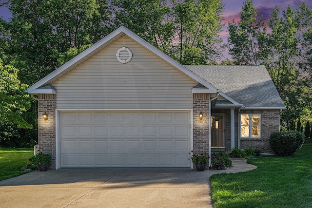 1314 Honeysuckle Ln, Niles, MI 49120 - ranch-style house with brick siding, driveway, a front lawn, an attached garage, and roof with shingles
