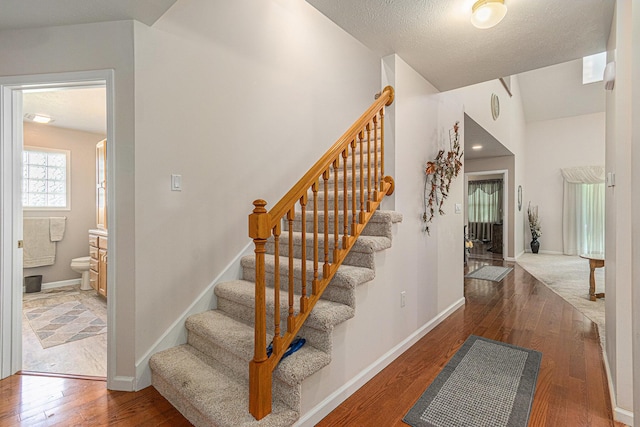 1314 Honeysuckle Ln, Niles, MI 49120 - stairway featuring hardwood / wood-style flooring and lofted ceiling