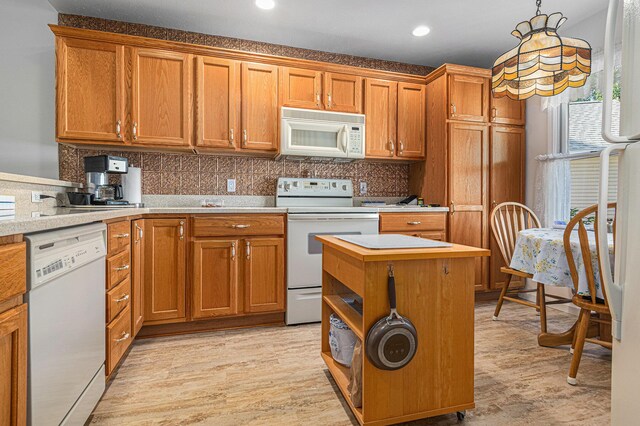 1314 Honeysuckle Ln, Niles, MI 49120 - kitchen featuring white appliances, brown cabinets, light wood-type flooring, and recessed lighting