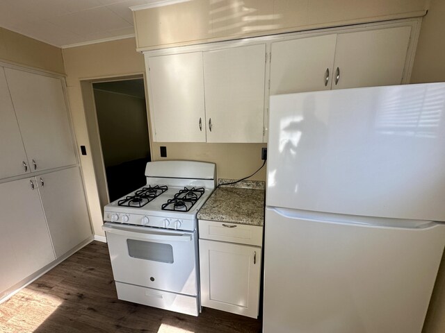 1805 Lakeshore Dr, Saint Joseph, MI 49085 - kitchen featuring white appliances, dark wood-style floors, white cabinetry, and ornamental molding