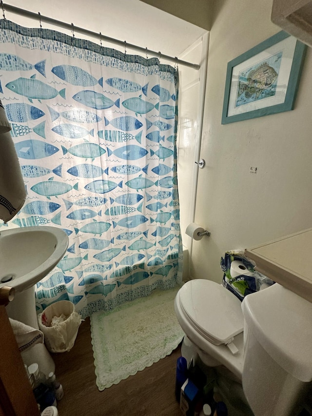 1805 Lakeshore Dr, Saint Joseph, MI 49085 - bathroom with a shower with curtain and wood finished floors
