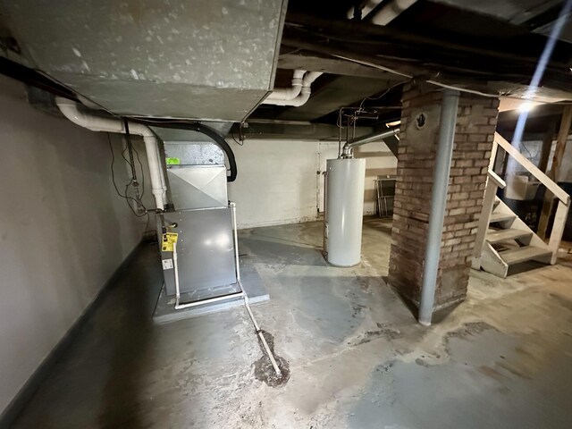 1805 Lakeshore Dr, Saint Joseph, MI 49085 - unfinished basement with water heater, heating unit, and stairs