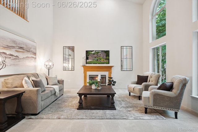 2538 Campbell Ct, Canton, MI 48188 - living area featuring a high ceiling, carpet flooring, and a glass covered fireplace