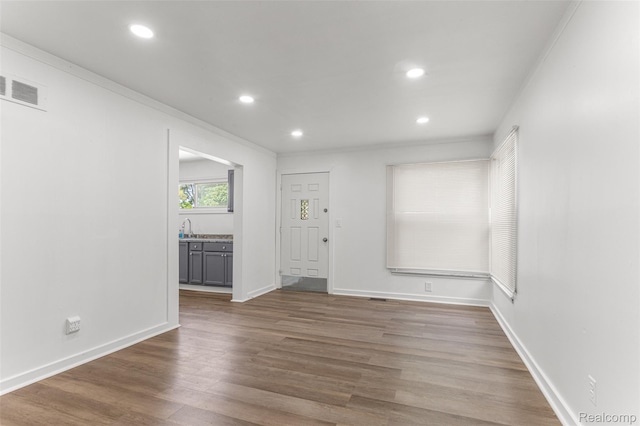 1085 Pennsylvania Ave, Lincoln Park, MI 48146 - unfurnished room featuring recessed lighting, wood finished floors, and crown molding