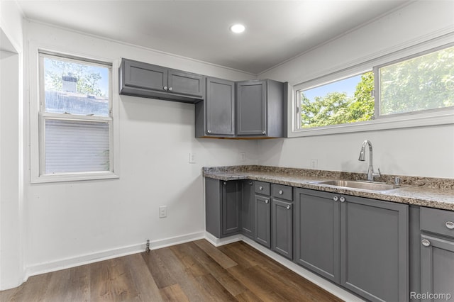 1085 Pennsylvania Ave, Lincoln Park, MI 48146 - kitchen featuring gray cabinets, dark wood-style flooring, healthy amount of natural light, and recessed lighting