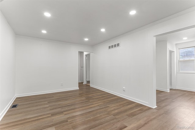 1085 Pennsylvania Ave, Lincoln Park, MI 48146 - empty room featuring crown molding, wood finished floors, and recessed lighting