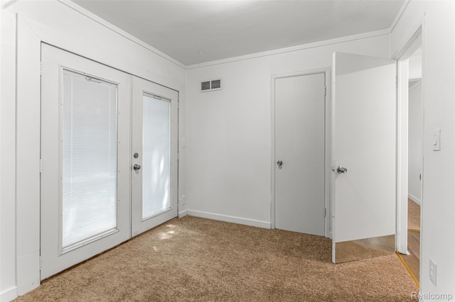 1085 Pennsylvania Ave, Lincoln Park, MI 48146 - carpeted empty room with french doors