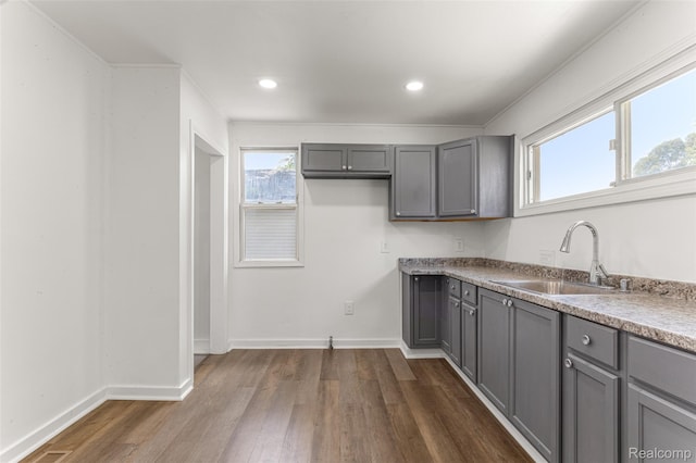 1085 Pennsylvania Ave, Lincoln Park, MI 48146 - kitchen featuring gray cabinetry, dark wood-style flooring, and recessed lighting
