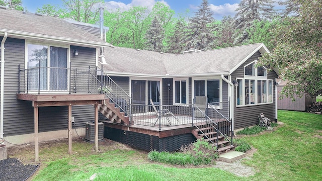 7640 W H Ave, Kalamazoo, MI 49009 - back of property featuring stairs, roof with shingles, a yard, and a wooden deck