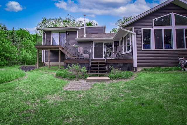 7640 W H Ave, Kalamazoo, MI 49009 - back of property with stairway, a wooden deck, and a lawn