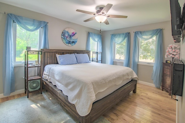 7640 W H Ave, Kalamazoo, MI 49009 - bedroom with light wood-type flooring and a ceiling fan