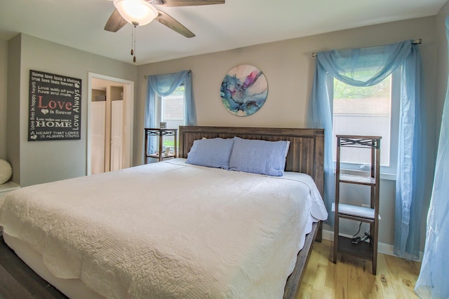 7640 W H Ave, Kalamazoo, MI 49009 - bedroom with light wood-type flooring and ceiling fan