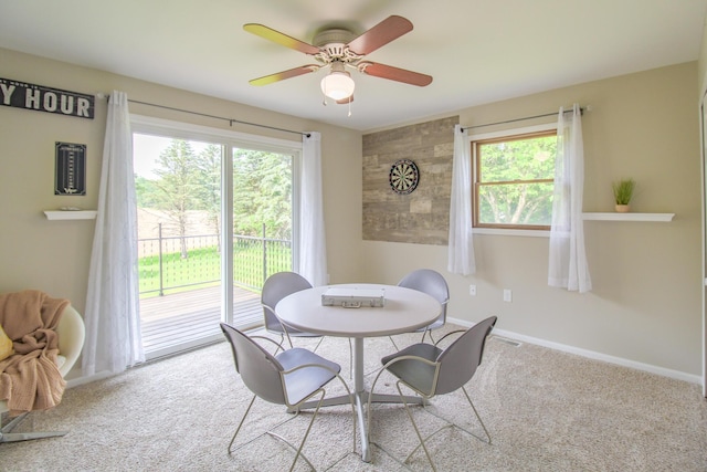 7640 W H Ave, Kalamazoo, MI 49009 - carpeted dining space featuring ceiling fan and baseboards
