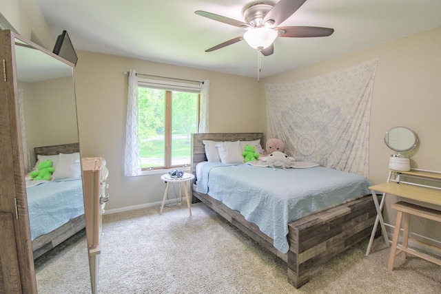 7640 W H Ave, Kalamazoo, MI 49009 - carpeted bedroom with ceiling fan and baseboards