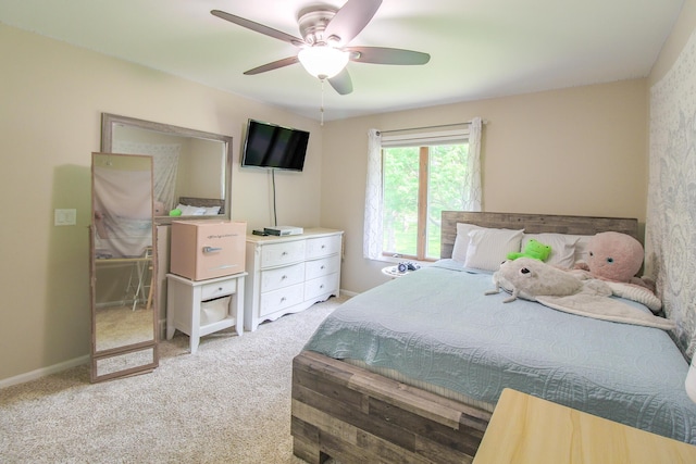 7640 W H Ave, Kalamazoo, MI 49009 - carpeted bedroom featuring a ceiling fan and baseboards
