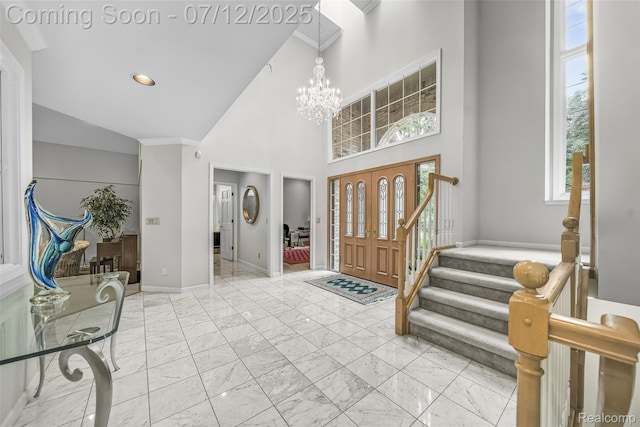 4532 Franklin Mill Rd, Southfield, MI 48301 - entryway featuring light marble finish floors, a chandelier, stairs, a high ceiling, and ornamental molding