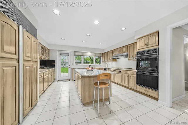4532 Franklin Mill Rd, Southfield, MI 48301 - kitchen featuring a center island, under cabinet range hood, a breakfast bar area, cooktop, and recessed lighting