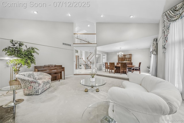 4532 Franklin Mill Rd, Southfield, MI 48301 - living area with high vaulted ceiling, stairway, carpet, a chandelier, and recessed lighting