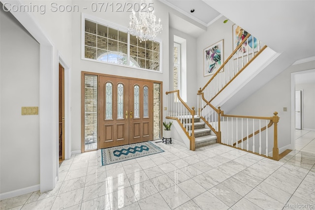 4532 Franklin Mill Rd, Southfield, MI 48301 - entrance foyer featuring a chandelier, a towering ceiling, marble look tiles, and stairs
