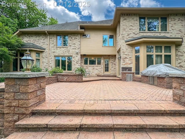 4532 Franklin Mill Rd, Southfield, MI 48301 - back of property with a patio and brick siding