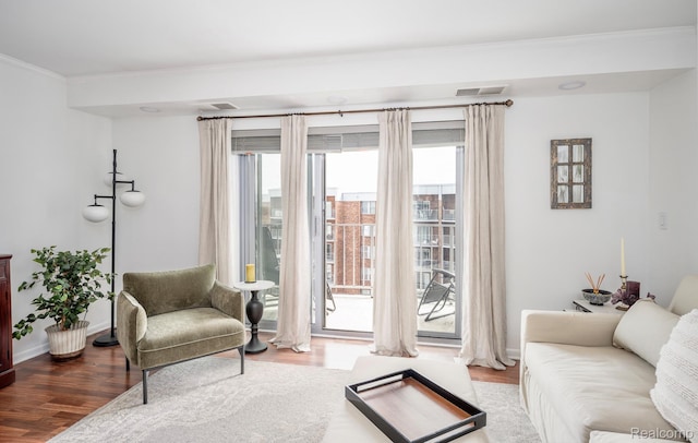 411 S Old Woodward Ave Unit 1007, Birmingham, MI 48009 - living area with ornamental molding, wood finished floors, and healthy amount of natural light