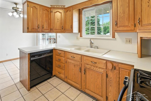 2295 Plainview Dr, Saginaw, MI 48603 - kitchen with dishwasher, stove, light tile patterned floors, and brown cabinets
