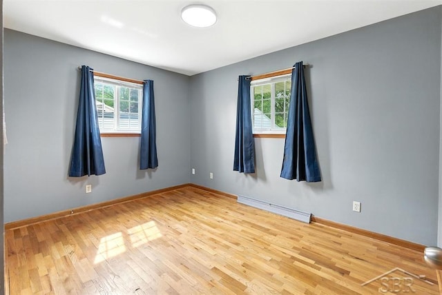 2295 Plainview Dr, Saginaw, MI 48603 - empty room featuring wood finished floors and baseboards