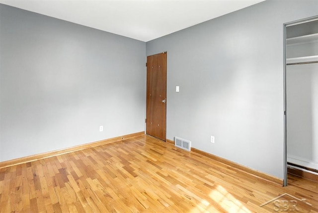 2295 Plainview Dr, Saginaw, MI 48603 - unfurnished bedroom with light wood-style floors and a closet