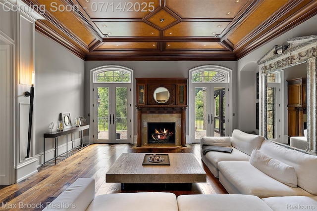 7420 Inner Circle Dr, Bloomfield Hills, MI 48301 - living area featuring french doors, ornamental molding, plenty of natural light, a high end fireplace, and coffered ceiling