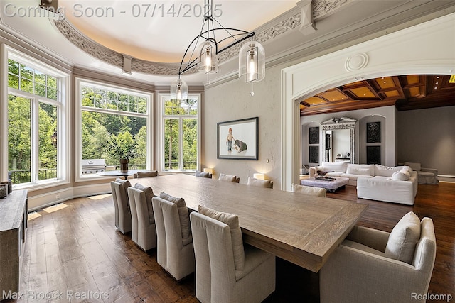 7420 Inner Circle Dr, Bloomfield Hills, MI 48301 - dining space featuring crown molding, arched walkways, and dark wood-type flooring