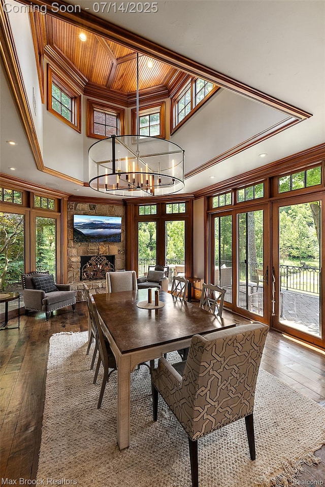 7420 Inner Circle Dr, Bloomfield Hills, MI 48301 - dining room with a high ceiling, crown molding, a wooden ceiling with exposed beams, wood-type flooring, and healthy amount of natural light