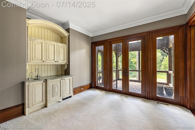 7420 Inner Circle Dr, Bloomfield Hills, MI 48301 - doorway to outside with french doors, light carpet, ornamental molding, and wet bar