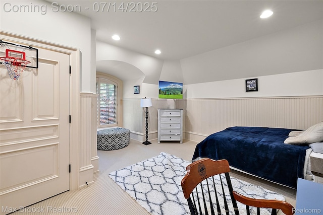 7420 Inner Circle Dr, Bloomfield Hills, MI 48301 - bedroom with carpet floors, a wainscoted wall, recessed lighting, lofted ceiling, and arched walkways