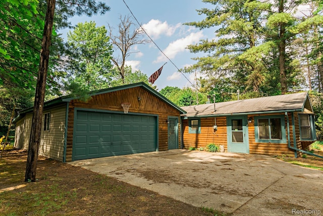 4176 Kings Corner Rd, Glennie, MI 48737 - view of front of house with driveway and a garage
