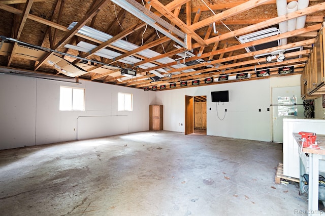 4176 Kings Corner Rd, Glennie, MI 48737 - garage featuring a garage door opener