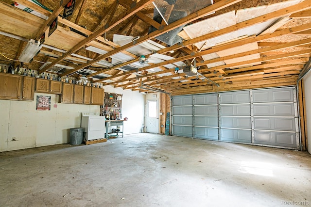 4176 Kings Corner Rd, Glennie, MI 48737 - garage with washer / clothes dryer and a garage door opener