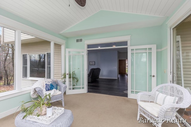 8790 Laurel Ridge Dr SE, Alto, MI 49302 - sunroom / solarium featuring french doors, lofted ceiling, and carpet