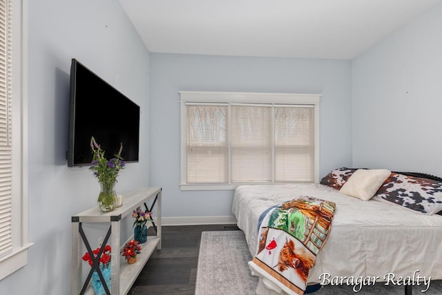 8790 Laurel Ridge Dr SE, Alto, MI 49302 - bedroom with dark wood-style flooring and baseboards