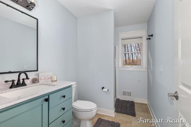 8790 Laurel Ridge Dr SE, Alto, MI 49302 - full bath with vanity, a shower stall, and tile patterned flooring