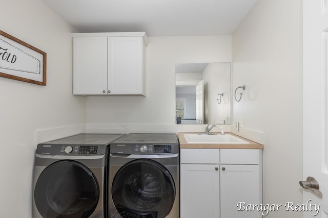8790 Laurel Ridge Dr SE, Alto, MI 49302 - washroom with washer and clothes dryer and cabinet space