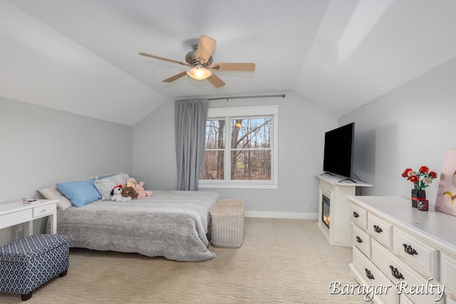 8790 Laurel Ridge Dr SE, Alto, MI 49302 - bedroom with vaulted ceiling, ceiling fan, and light colored carpet