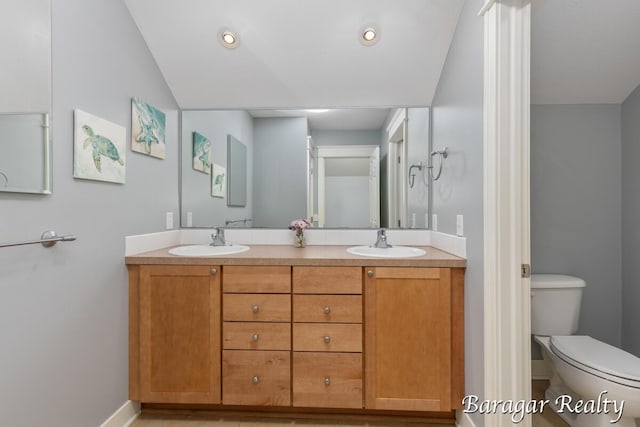 8790 Laurel Ridge Dr SE, Alto, MI 49302 - full bath with double vanity and toilet