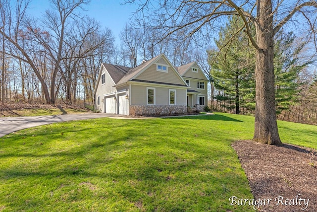 8790 Laurel Ridge Dr SE, Alto, MI 49302 - view of front of property featuring concrete driveway and a front yard